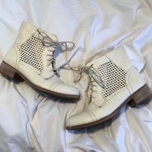 Detailed white ankle boots